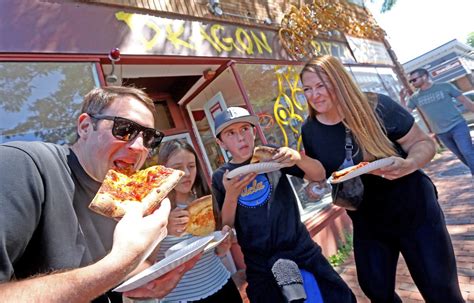 Somerville’s Dragon Pizza owner and Barstool’s Dave Portnoy trade ‘F’ bombs, flip each other off in Davis Square